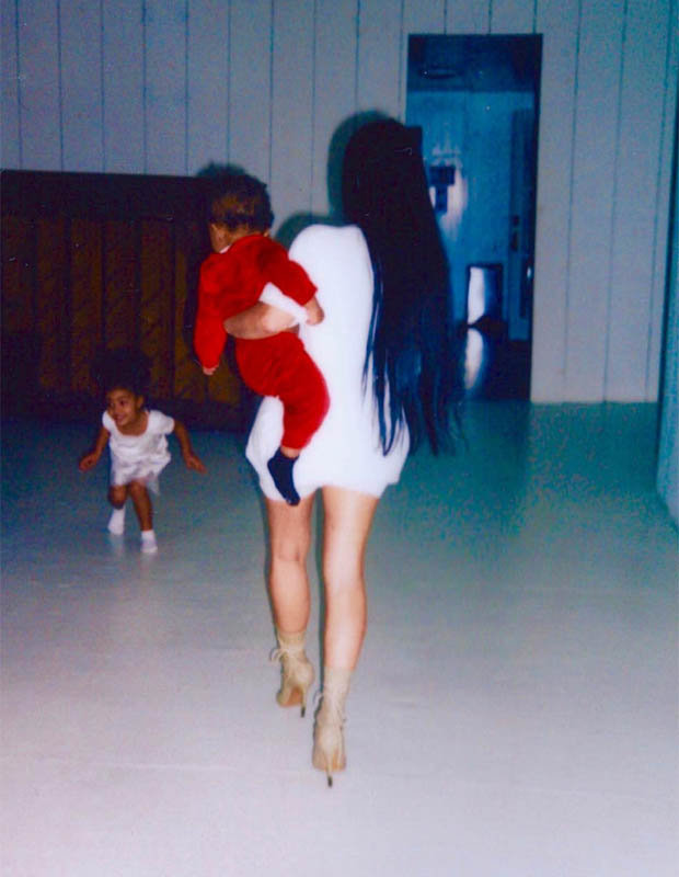 Kim Kardashian holding kids